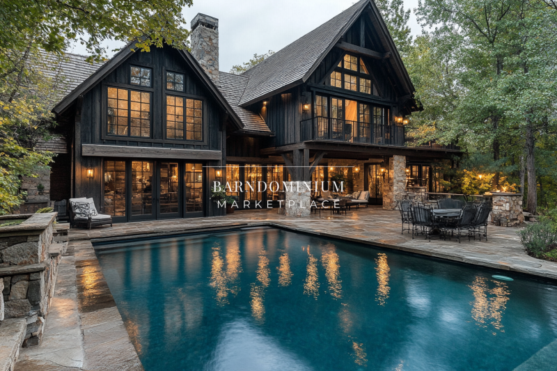 A luxurious black barndominium with expansive glass windows, warm interior lighting, and a beautiful poolside patio, offering a perfect blend of rustic and modern charm.
