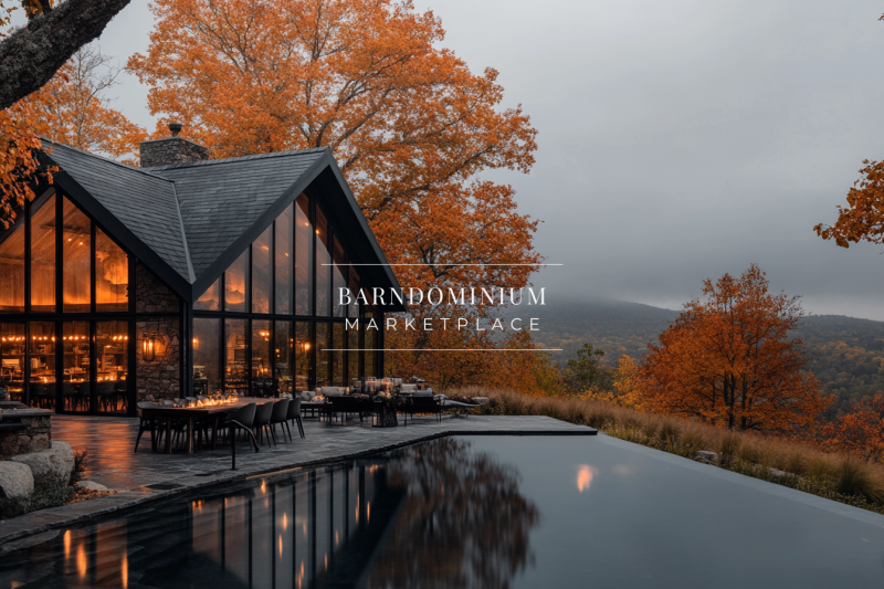 Modern glass-walled barndominium overlooking a stunning autumn landscape, with a sleek infinity pool reflecting the warm glow of the home’s interior.