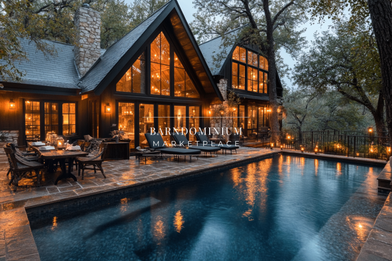 A luxurious barndominium exterior with warm glowing lights, a serene pool, and rustic charm, creating the perfect evening retreat in nature.