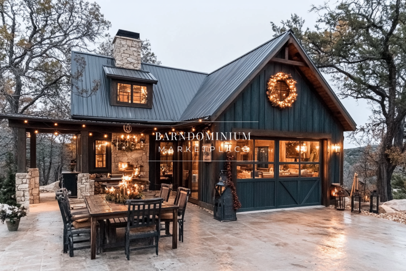 A stunning barndominium exterior featuring modern rustic charm, warm outdoor lighting, and a cozy farmhouse aesthetic.