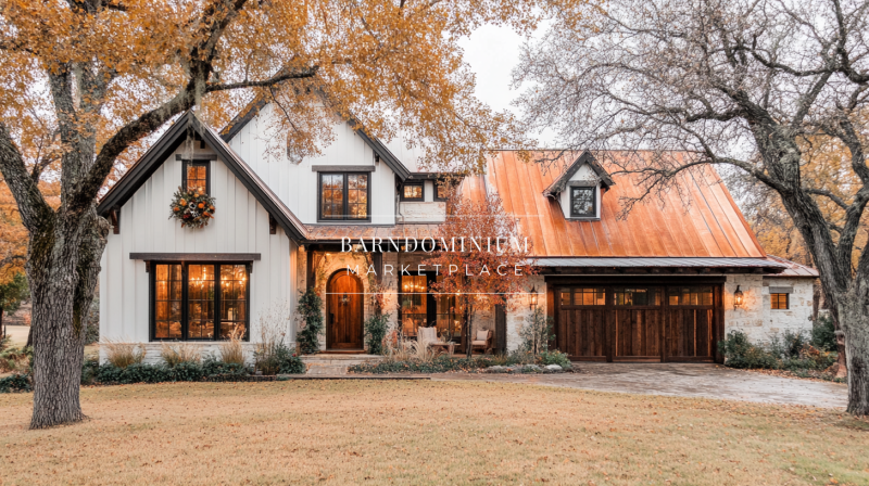 Elegant white barndominium with a copper roof, warm wood accents, and beautiful autumn landscaping.