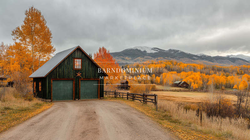 A picturesque barn-style garage set against a stunning autumn landscape, featuring golden foliage and distant mountain views.