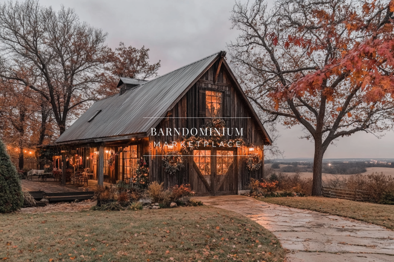 Charming rustic barndominium exterior with warm string lights, weathered wood siding, and a peaceful countryside setting.