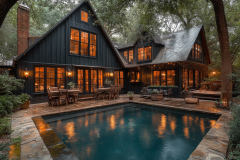 A stunning black barndominium with warm glowing windows, surrounded by lush trees and featuring a serene backyard pool.