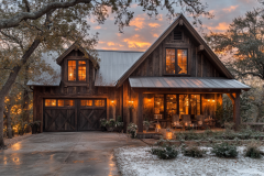 Charming rustic barndominium with warm farmhouse lighting, rich wood textures, and a cozy porch, set against a breathtaking winter sunset.
