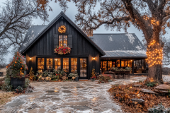 A charming black barndominium decorated for the holidays, featuring warm lights, festive wreaths, and a cozy winter ambiance.