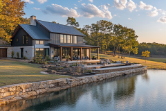 Elegant waterfront barndominium with a modern rustic design and a stunning outdoor living space.