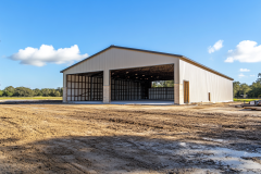 Spacious metal barndominium shell with open bays, ideal for workshop or living space conversion.
