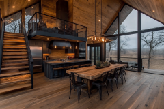 Modern rustic barndominium with an open-concept design, floor-to-ceiling windows, and a stylish lofted living space.