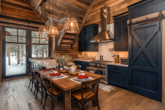 Warm and inviting barndominium kitchen with rustic wood accents, navy cabinetry, and modern farmhouse lighting.