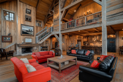 A breathtaking barndominium interior with high vaulted ceilings, exposed wood beams, a cozy loft, and an open-concept living area featuring rustic charm and modern comfort.
