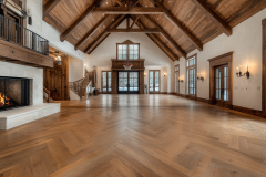 Spacious barndominium interior with soaring vaulted ceilings, exposed wood beams, a grand fireplace, and elegant French doors for a rustic yet refined atmosphere.