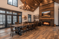 Elegant barndominium dining area with vaulted ceilings and a cozy fireplace.