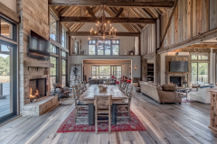 Expansive barndominium interior with vaulted ceilings, exposed beams, and a grand open-concept living and dining area.