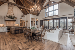 Stunning barndominium interior with vaulted ceilings, a spacious open-concept kitchen, and a cozy living area.
