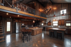 This spacious barndominium blends rustic wood cabinetry, metal siding, and a lofted second level for a perfect fusion of modern farmhouse style and industrial charm.