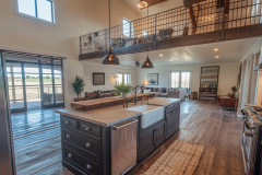 Rustic Barndominium Kitchen with Open Loft and Farmhouse Sink